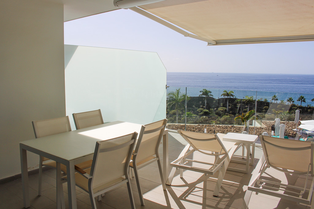 Spacious terrace with ocean view and direct access to the living room and kitchen in Royal Hideaway Corales Suites apartment 1308.