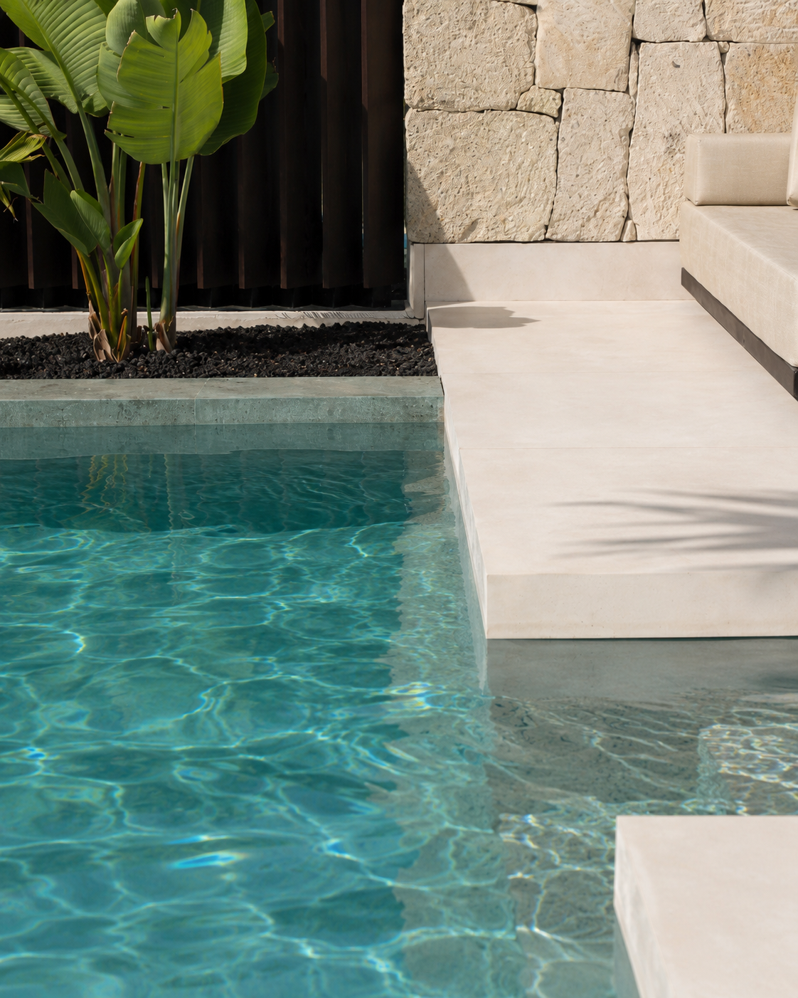 heated pool and palm , banana plants in corales villas, luxury resort hotel with villas